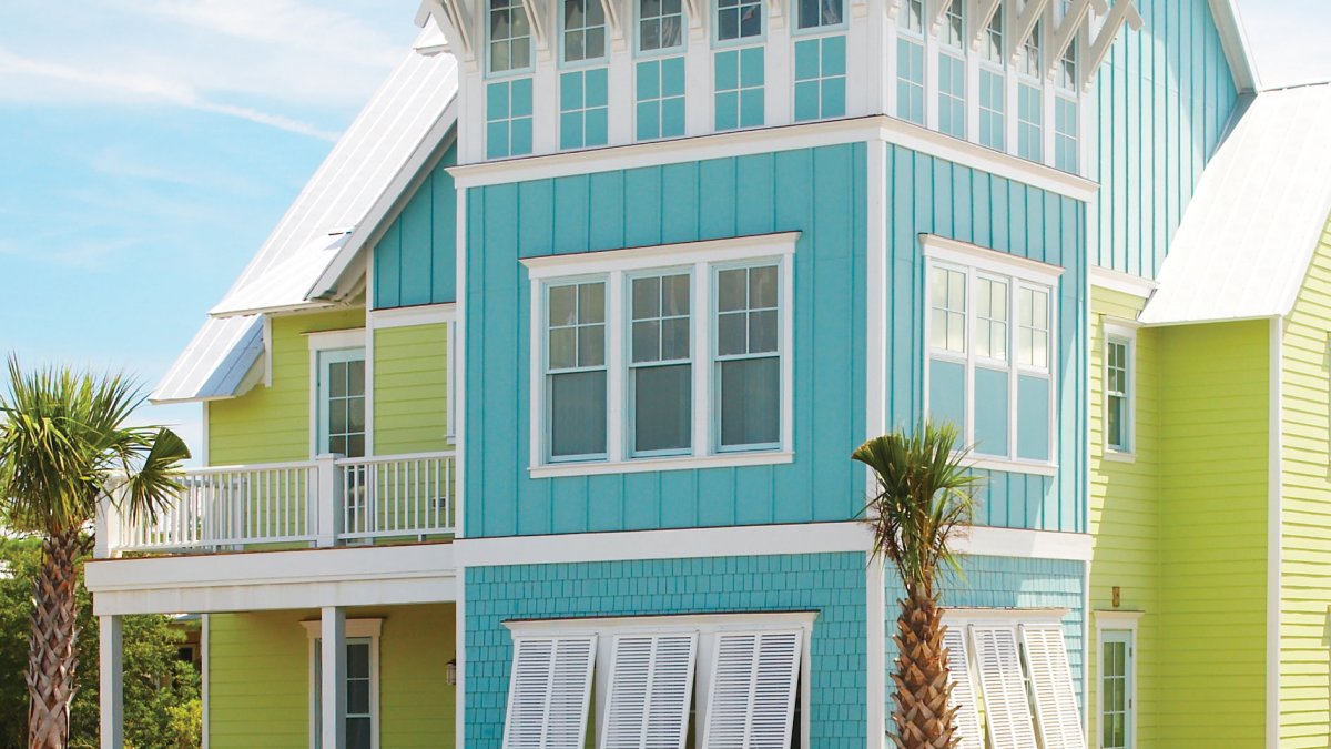 turquoise beach home with white shutters and trim accents