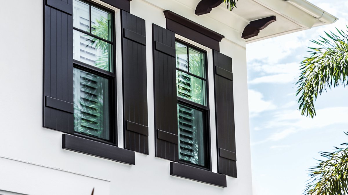 image of beach home with foliage surrounding