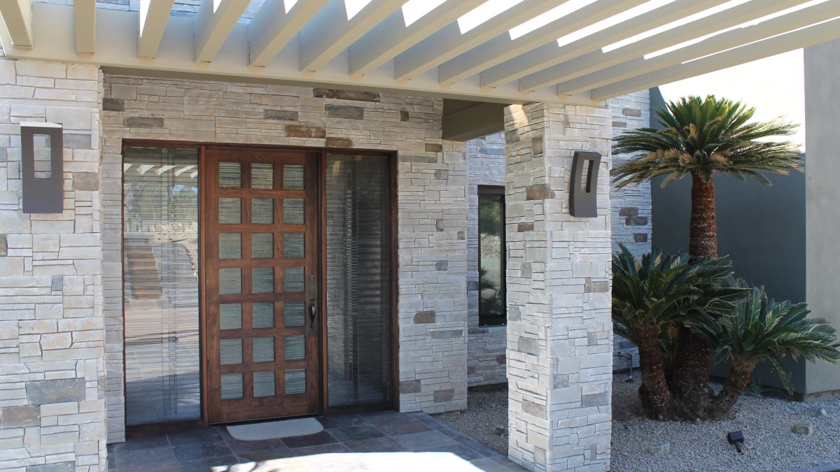 entrance of a luxury home with stone accents