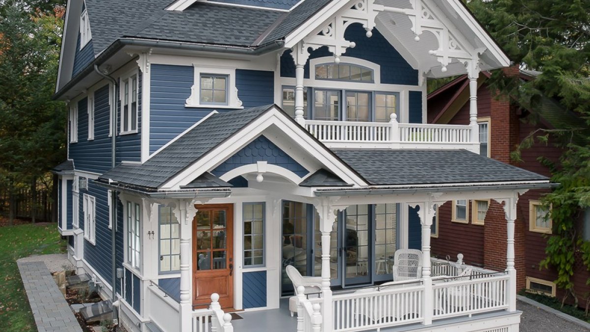 Blue Colonial Style Home with detailed white trim