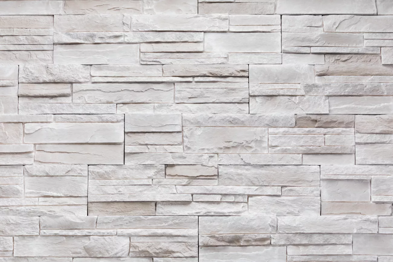 close up shot of white stone siding