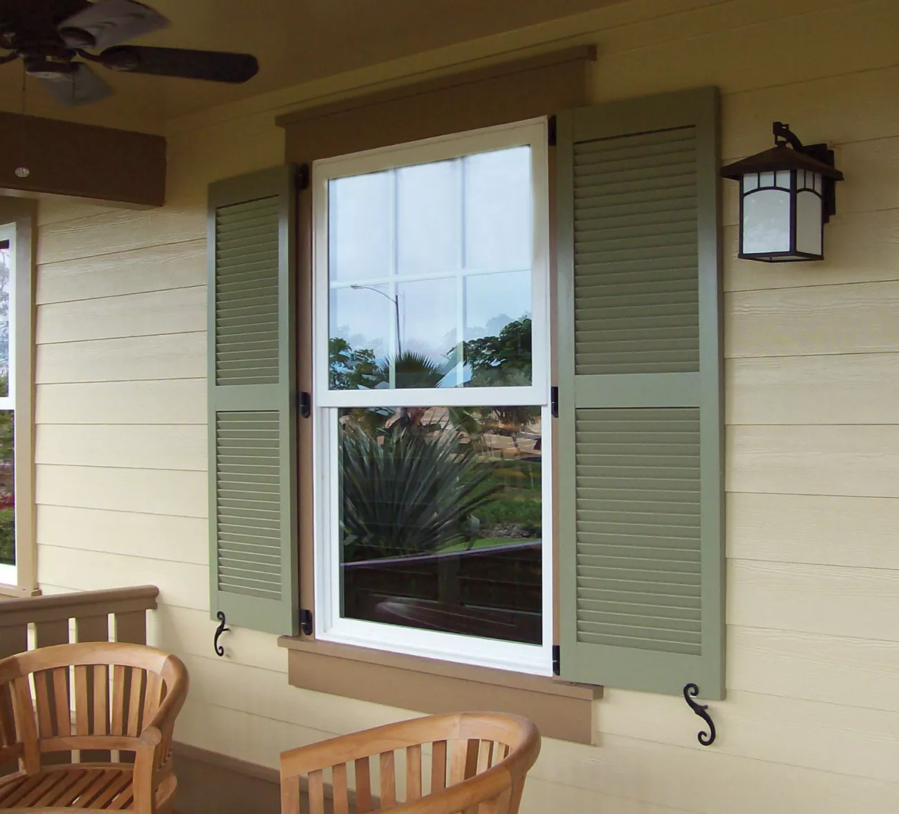 close up of green faux lover shutters