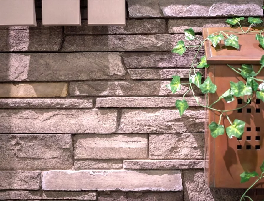 close up product shot of ledgestone siding with a flower box